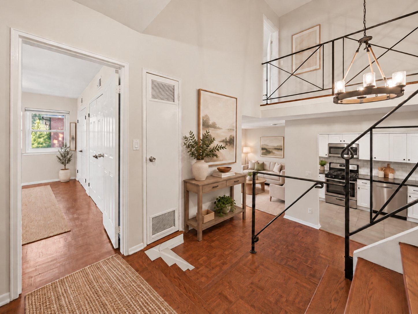 Foyer and contemporary metal staircase at 361 Claremont Avenue, Unit 3 (virtually staged)