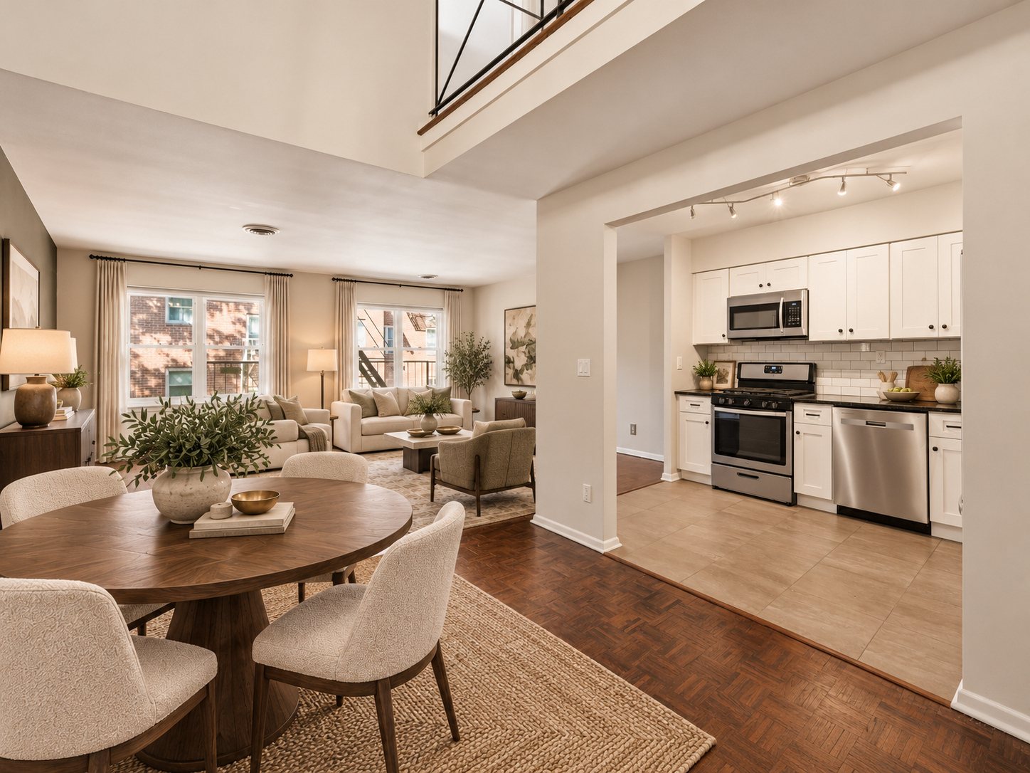 Dining area with the kitchen and living room beyond (virtually staged)